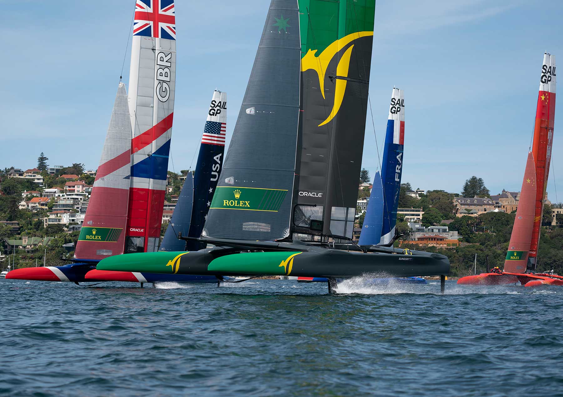 Australia SAILGP Team skippered by Tom Slingsby moves away from the pack in Sydney Harbour, Sydney, Australia.Photo: Bob Martin for SailGP